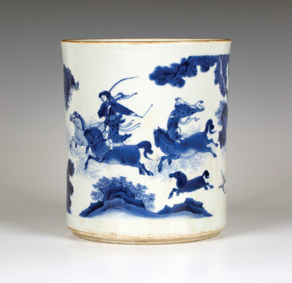 A £37,000 rare Chinese Transitional period, mid-17th Century, blue and white porcelain brush pot (bitong), decorated with horses and three female acrobat riders
