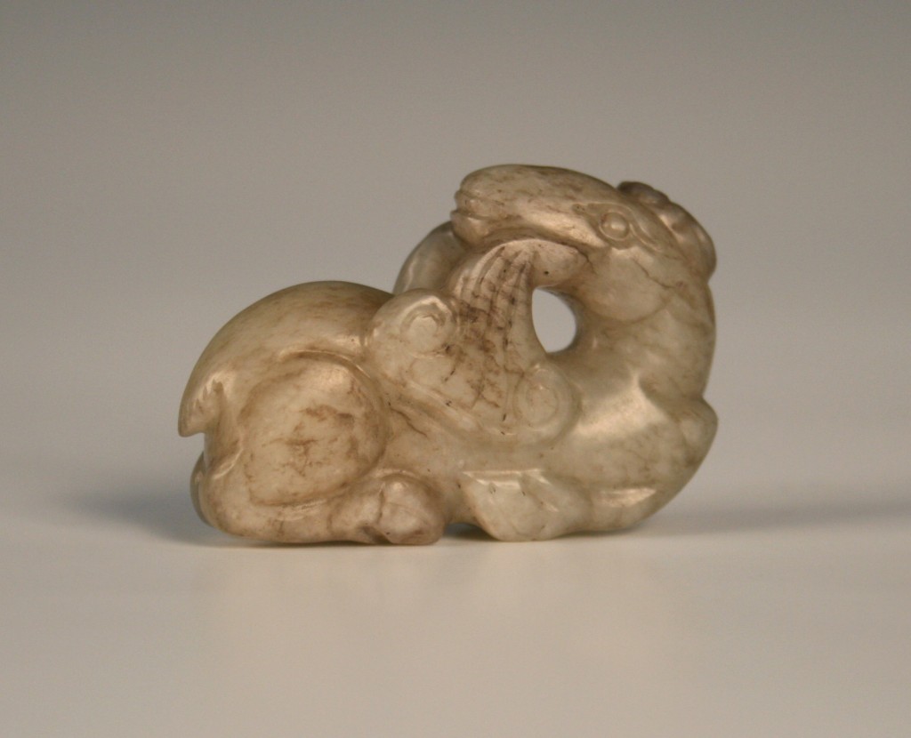 1117 A Chinese archaic jade carving of a deer biting a Lingzhi fungus
