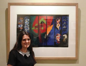 Katy Norris, Pallant House Curatorial Assistant and Exhibition Curator for Modern British Collage and its Legacy, with John Piper’s preliminary collage design for the Chichester Cathedral tapestry, circa 1965.