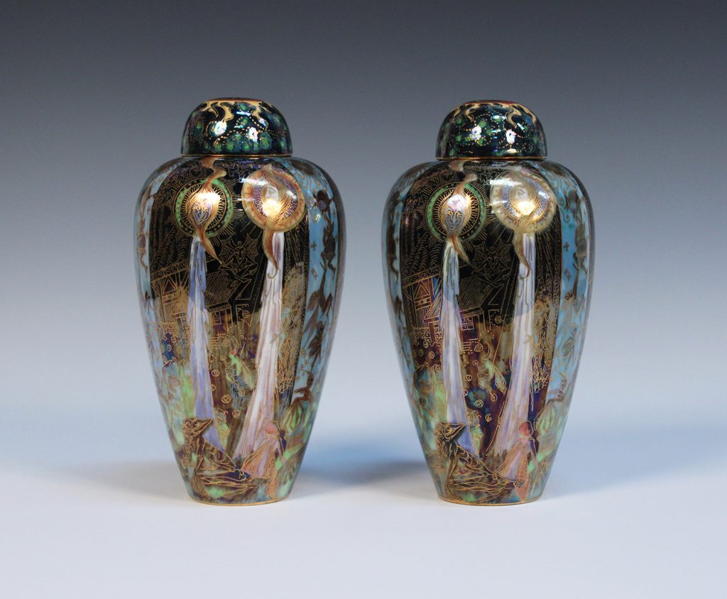 A pair of Wedgwood Fairyland Lustre malfrey pots and covers, designed by Daisy Makeig-Jones, each decorated with Candelmas design, height 21cm