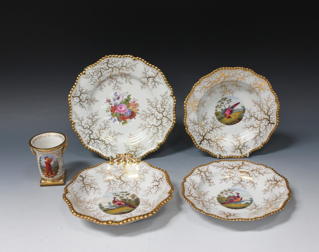 A group of early 19th century Flight Barr & Barr Worcester porcelain including two dessert bowls and a dish attributed to Charles Stinton decorated with exotic birds