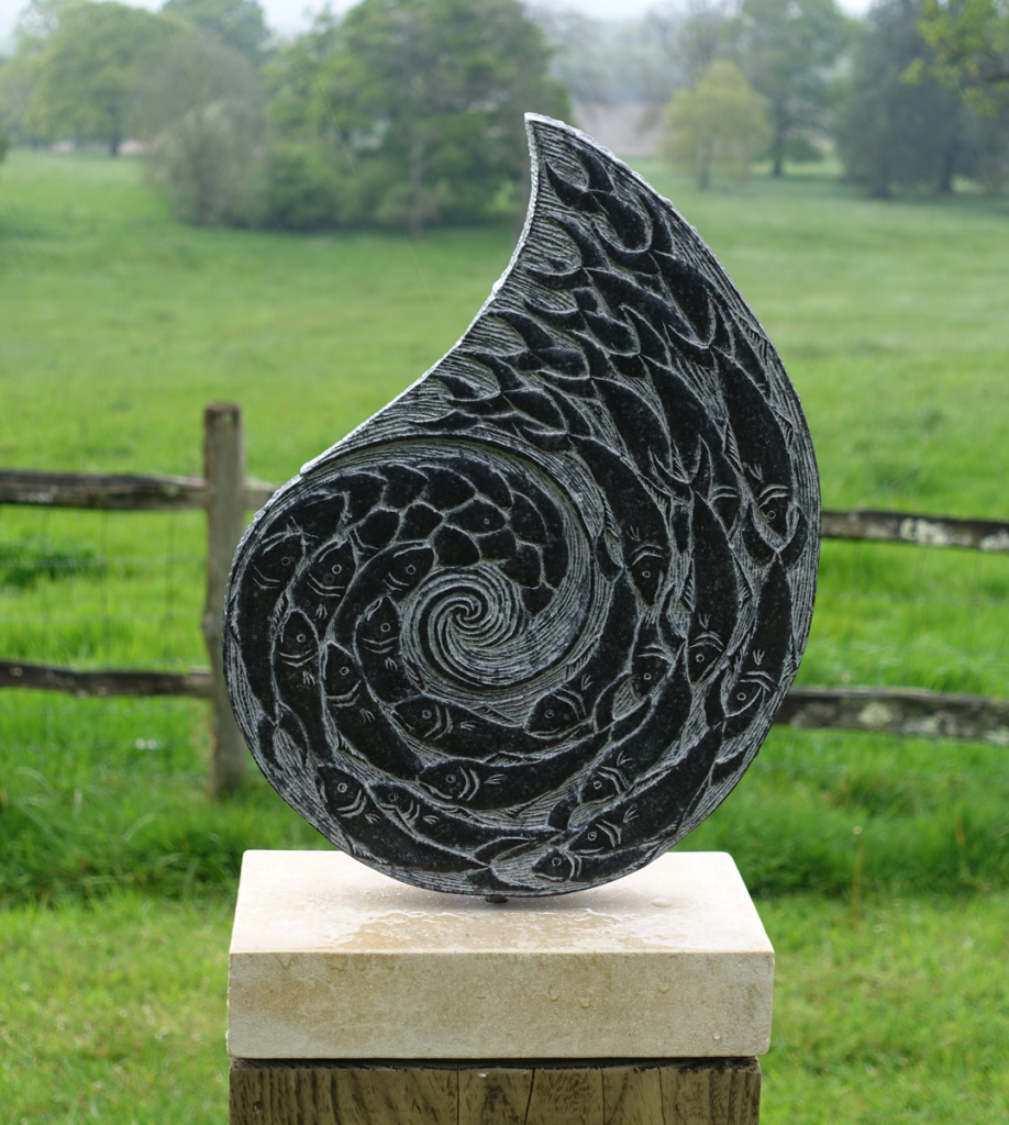 Devon based artist Zoe Singleton’s sculpture ‘The Turning Tide’ carved from Kilkenny Fossil Stone at Borde Hill