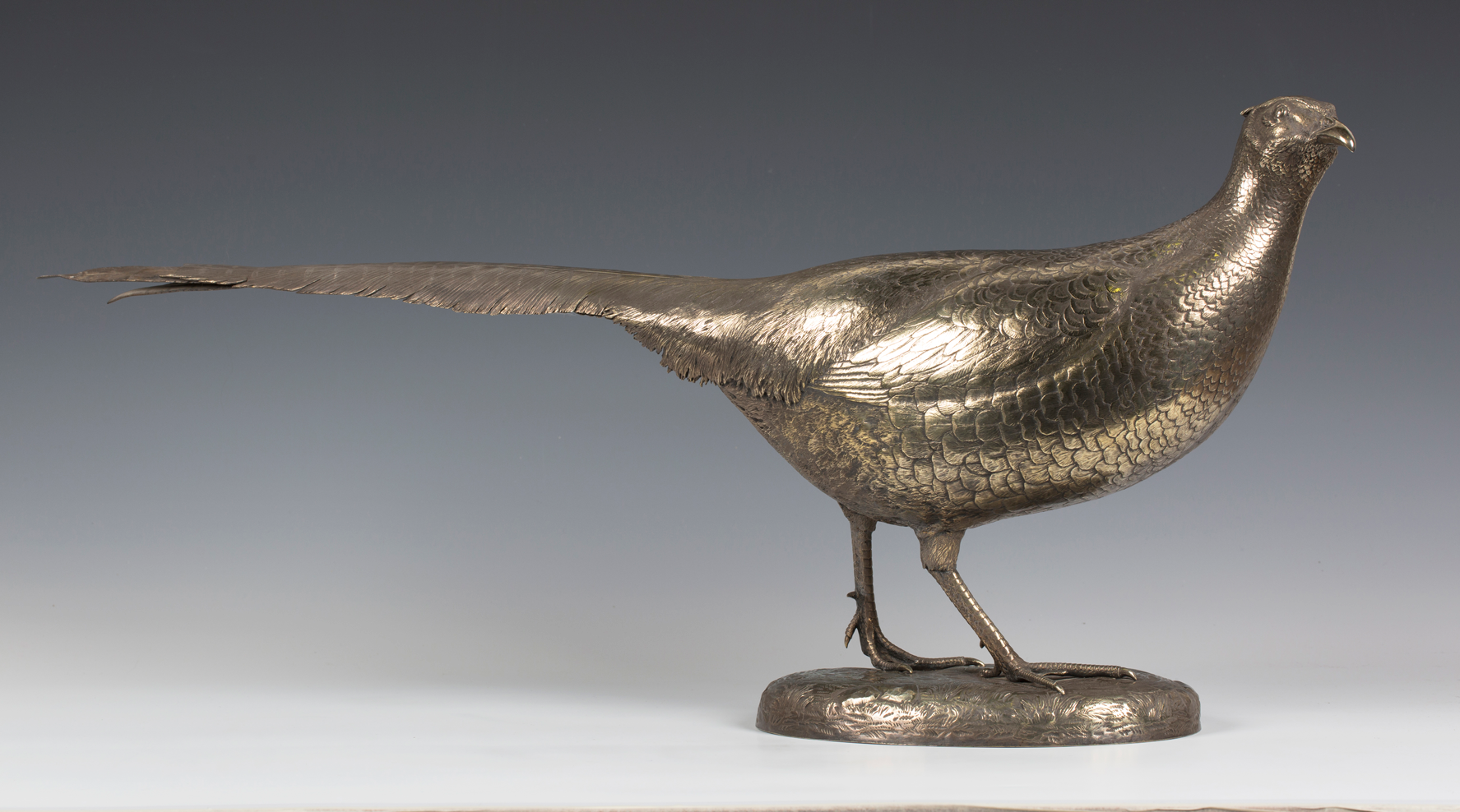A George V silver gilt pheasant